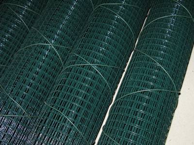 Four dark-green PVC coated welded wire mesh rolls tied with green PVC wires