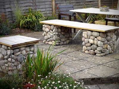 Table, bench made of welded gabion in the backyard.