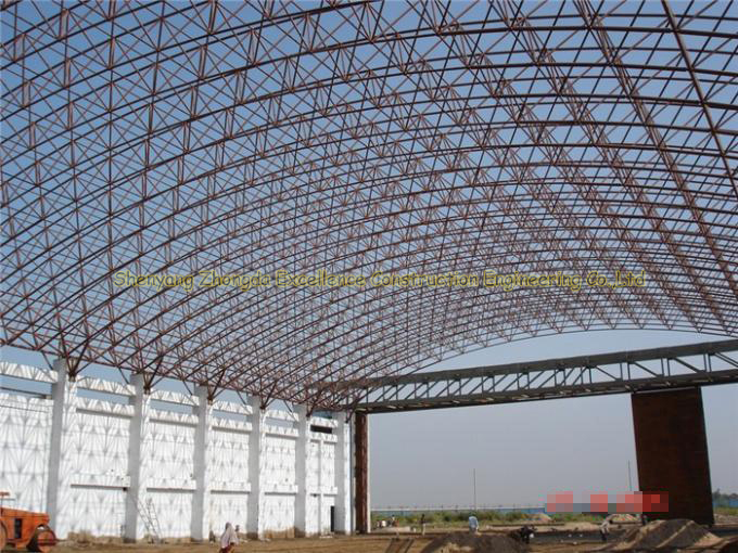 Inexpensive long span steel airplane hangar with arch roof truss