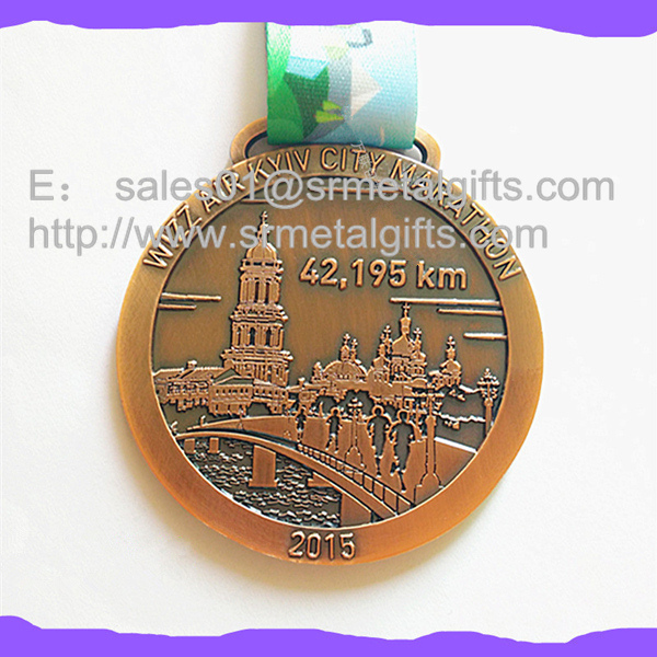 Engraved metal sports medal with ribbon lace