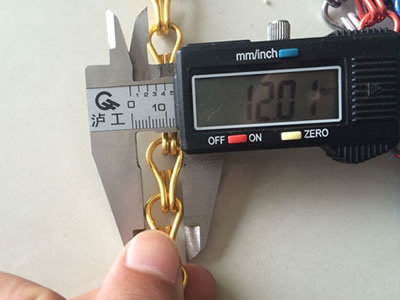 Measuring the hook width of chin link curtain, it's about 12.01 mm.