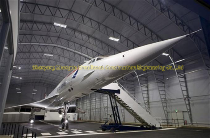 Inexpensive long span steel airplane hangar with arch roof truss