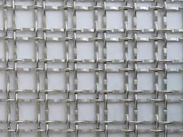 A piece of hard mesh with square holes.