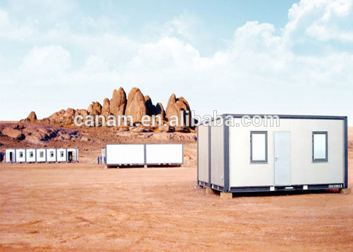 small moving modified shipping containers homes with pillars and two windows.jpg