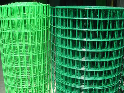 Two rolls of PVC coated welded wire mesh, one roll green, another light-green color.