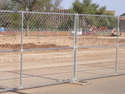 Galvanized temporary fencing around construction site.