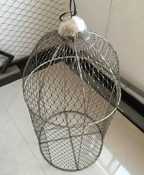 A big aviary for large birds is composed of stainless steel rope mesh with ferrules for added strength and reliability.