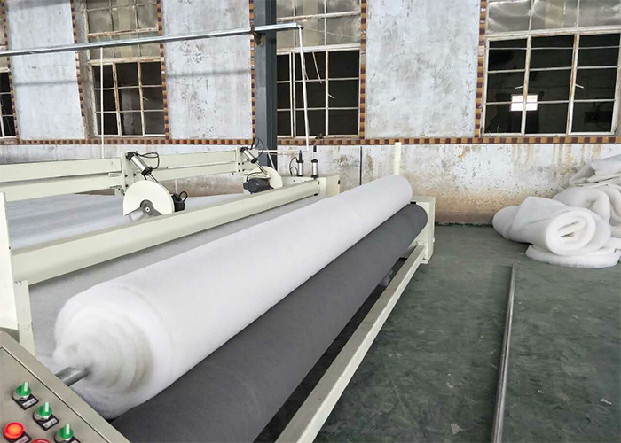 NON-WOVEN WINDING AND CUTTING MACHINE