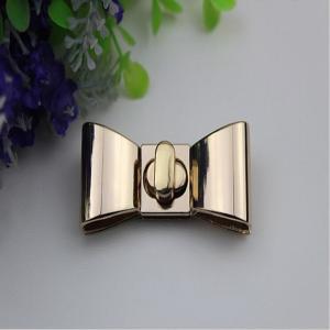 China Hanging plating zinc alloy fashion gold metal bow-knot pattern small purse turn locks supplier