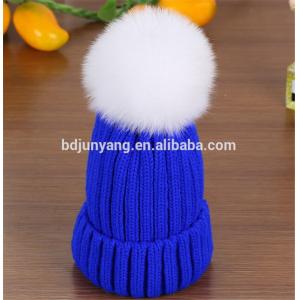 women knit hat with fur poms