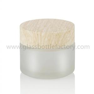 China 100g despejan, los tarros cosméticos de cristal de Frost con las tapas de madera supplier