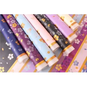 Wrapping Paper packing printed  glossy flowers with a material solid color above the edge