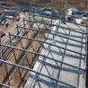 Almacén prefabricado con estructura de acero, gran luz y soporte para grúa