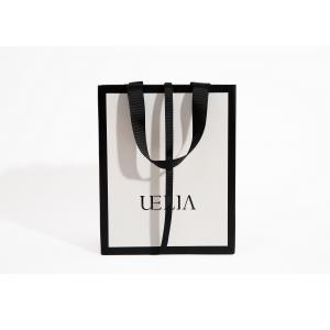 China Custom Printed White Luxury Boutique Paper Bag 250g For Clothes supplier
