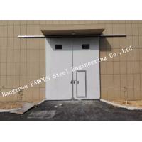 China Sectional Horizontal Sliding Industrial Garage Doors With Access Pedestrian Door For Workshop on sale