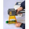 China Rubber Applicable 20W HandHeld Fiber Portable Laser Engraver Marking Machine for Date Logo wholesale