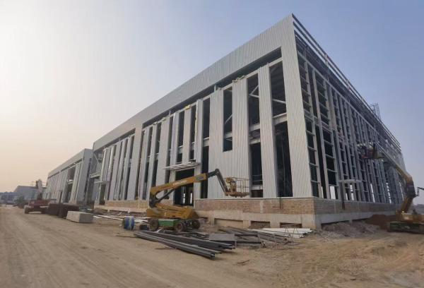 Industrial Steel Frame Warehouse With H Beam And Sandwich Panel Roof Cladding