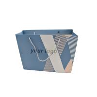 China Craft Paper Small Blue Custom Paper Shopping Bags With Ribbon on sale
