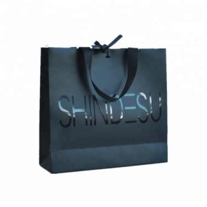 Customized Logo Printed Paper Merchandise Bags Luxury High Bearing Capacity