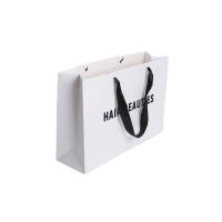 China Ribbon Handle Ivory Board Paper Bags With Custom Logo For Handmade Clothing Packaging on sale