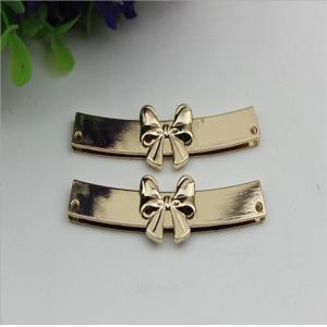 China OEM zinc alloy light gold bow-knot shape purse decorative metal corner 65 mm supplier