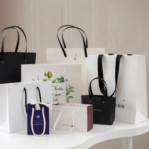 China Custom Luxury Cosmetic Paper Bags Clothing Shopping Bags With Handles supplier