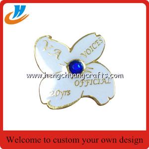 China Flower lapel pin badge custom,gold plated white logo custom metal lapel pin supplier