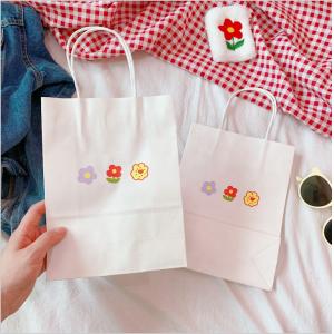 China Custom Printing Recyclable Paper Bags With Handles Flower Pattern supplier