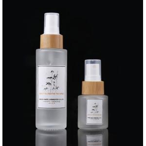 China Customizable 100ml Cosmetic Glass Bottle With Bamboo Pump Spray supplier