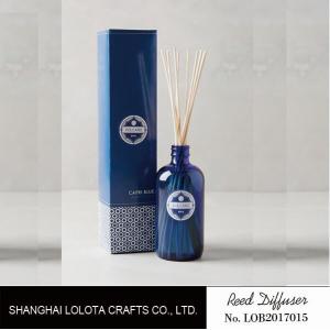 transparent blue color reed diffuser with natural stick and pattern folding box