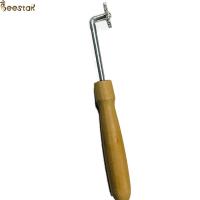 China Beekeeper Beehive Tools Wooden Handle Spur Embedder With Small Gear For Beekeeping on sale