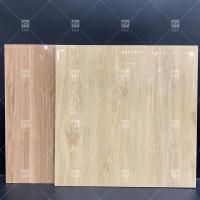 China High Glossy Interior Wood Look Porcelain Floor Tile Anti-slip Polished Glazed Porcelain Living Room Tiles For Flooring on sale