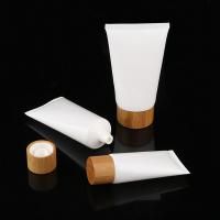 China wholesale empty 30ml plastic soft cosmetic tube, 60ml plastic white cream tube with bamboo cap, empty PET soft tube on sale