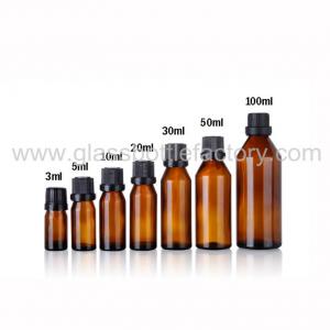 China European Design Amber Essential Oil Glass Bottles With Black Caps supplier