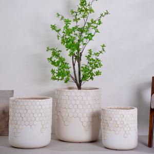 China Unique Honeycomb Design Pattern Neutral Beige Round Fiber Clay Planter For Tight Office Hallways wholesale