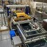 China Máquina automática de embalaje de jugo y agua potable Sistema de jaula de carga y descarga wholesale