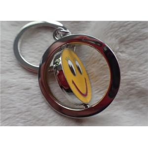 China Color Silver Key Chain Personalized Promotional Gifts With Rotatable Smiling Yellow Face supplier
