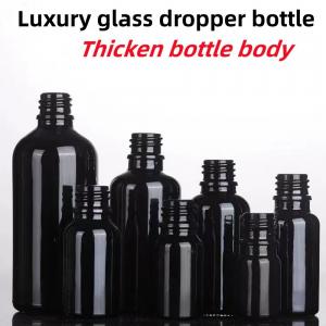 China Black 10, Ml 15ml 20ml 30ml 50ml empty round black shiny Glass Essential Oil Dropper Bottle with Plastic Gold ring supplier