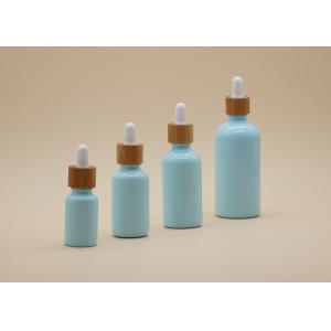 China Free Samples Blue Color Essential Oil Glass Bottles With Bamboo Dropper supplier