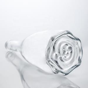 China Custom Logo Unique Floral Bottom Super Flint Long Neck 750ml Glass Bottle for Gin Cork supplier