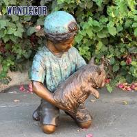 China Customized garden decoration, life-size bronze statue of a young man playing with his dog on sale