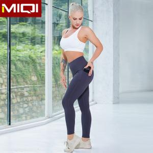 China Wholesale 2 Pieces Sport Clothing Set With Pocket Solid Fitness Leggings Women High Impact Sports Bra Set supplier