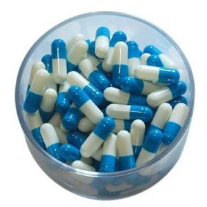 A gelatina dura vazia colorida do tamanho 00 encerra cápsulas farmacêuticas