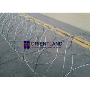 China 54-56 Loops Coiled Razor Barbed Wire With Steel Tape Sharp Edged Blades supplier