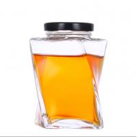 China 360ml Custom Clear Twist Shape Honey Glass Bottle Unique Honey Jars With Metal Cap on sale