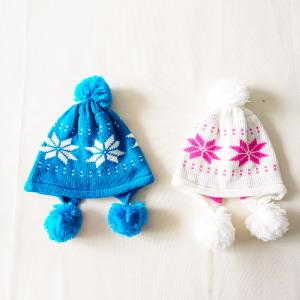 China Factory cheap Acrylic knitted cute caps snowflake dots pattern earflap winter hat with pompom for kids supplier