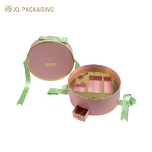 China XL Emballage Boîtes cosmétiques imprimées sur mesure Boîtes de luxe sur mesure en gros Boîte de papier cosmétique ronde avec un design unique Mini tiroir Boîte à ruban vert Poignée et plateau en or Pour les produits de beauté essentiels wholesale