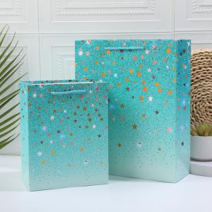 China Bronzing Stars Pattern Paper Bag With Starwing Handle Blight Colors supplier