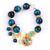 China 14MM Energy Healing Crystal Blue Tiger Eye Flower Spinner Charm Bead Bracelet For Daily Wear on sale