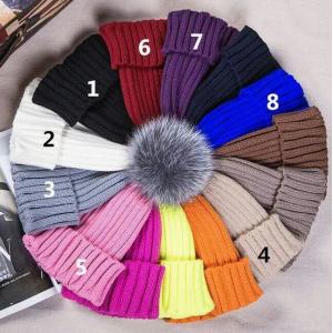 China Economical knitted hat raccoon fur ball warm beanie hat hat with fur pom pom supplier